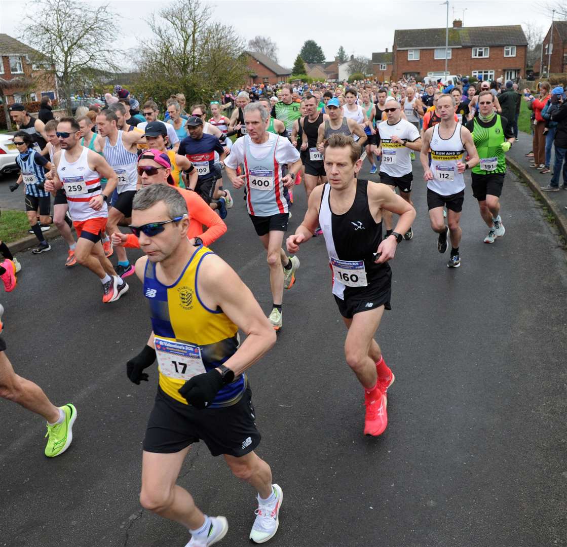 Leaving the start, Stamford Strider Adie Stevens in bib 17 and Marc Coles from Norwich Road Runners in bib 160