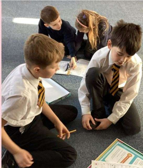 Year 4 and 5 pupils planning a class liturgy, which they do each week with school chaplain Lucy Wright