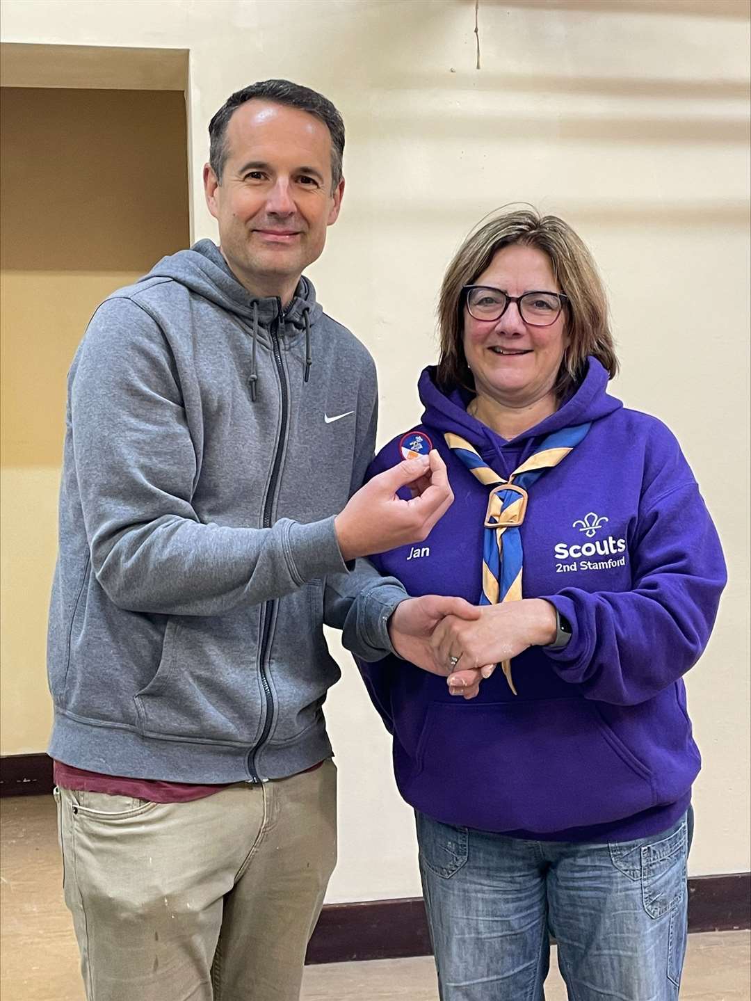 Tim Spencer receives a DIY badge from scout leader Jan Simmonds.