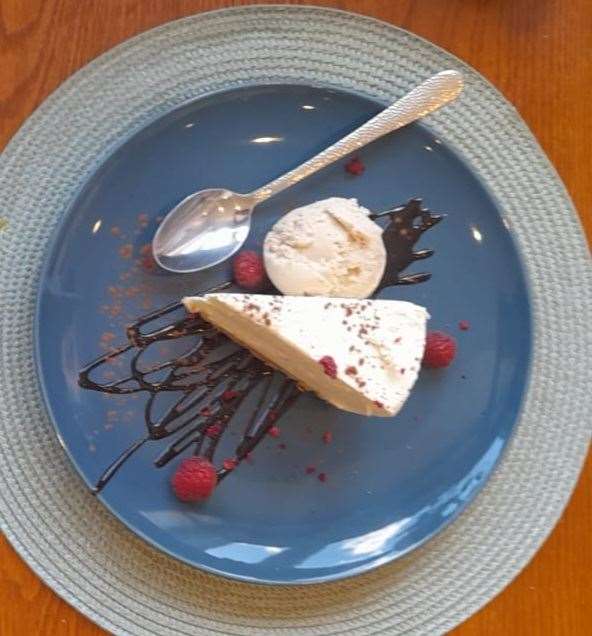 Amaretto cheesecake with Chantilly cream and chocolate sauce was unbelievably good