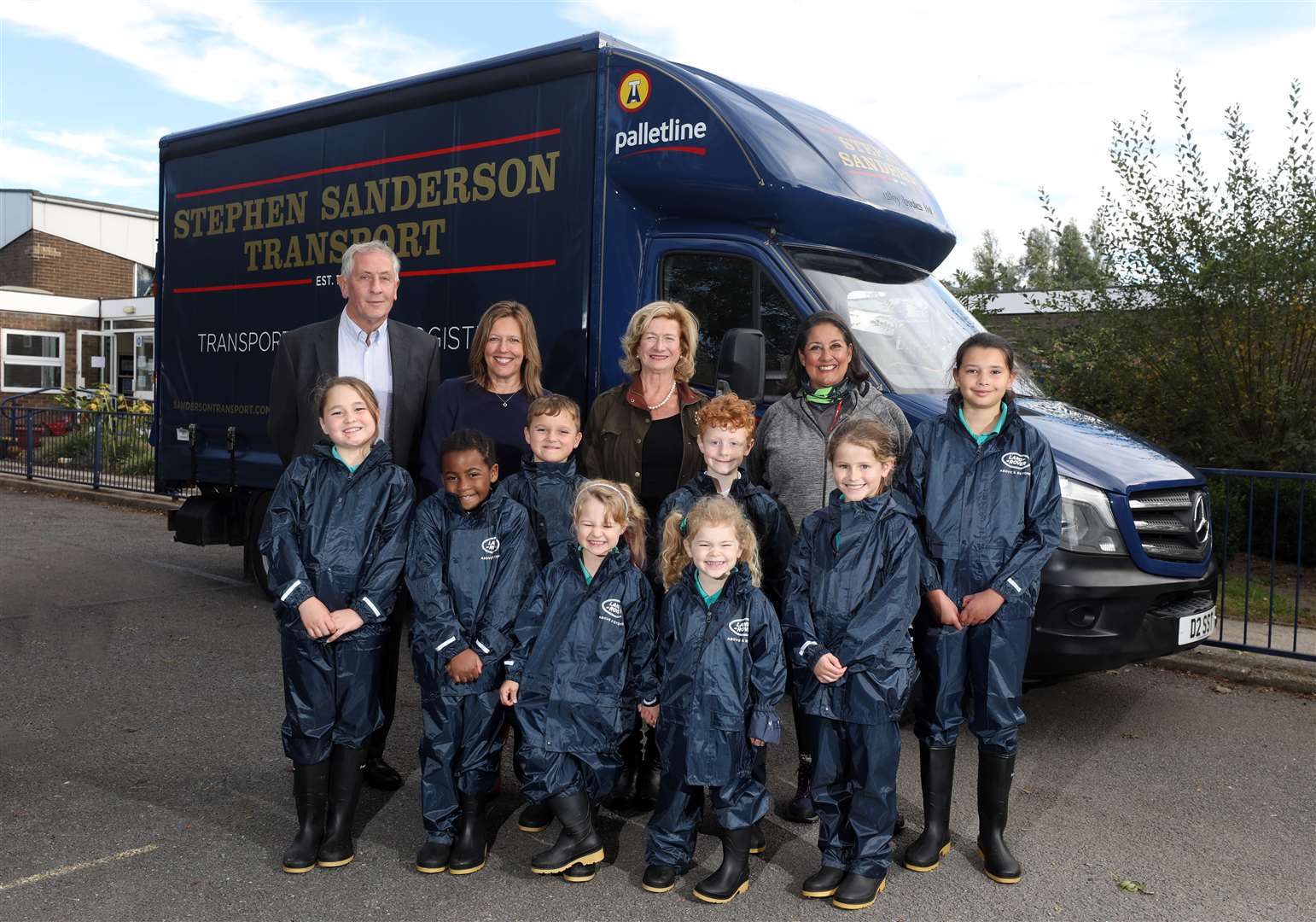Gina Bradbury Fox, Lord Lieutenant of Rutland, Jan and Stephen Sanderson and children of Edith Weston Primary School Waterproof and Wellies Project. Photo: Glen Minikin