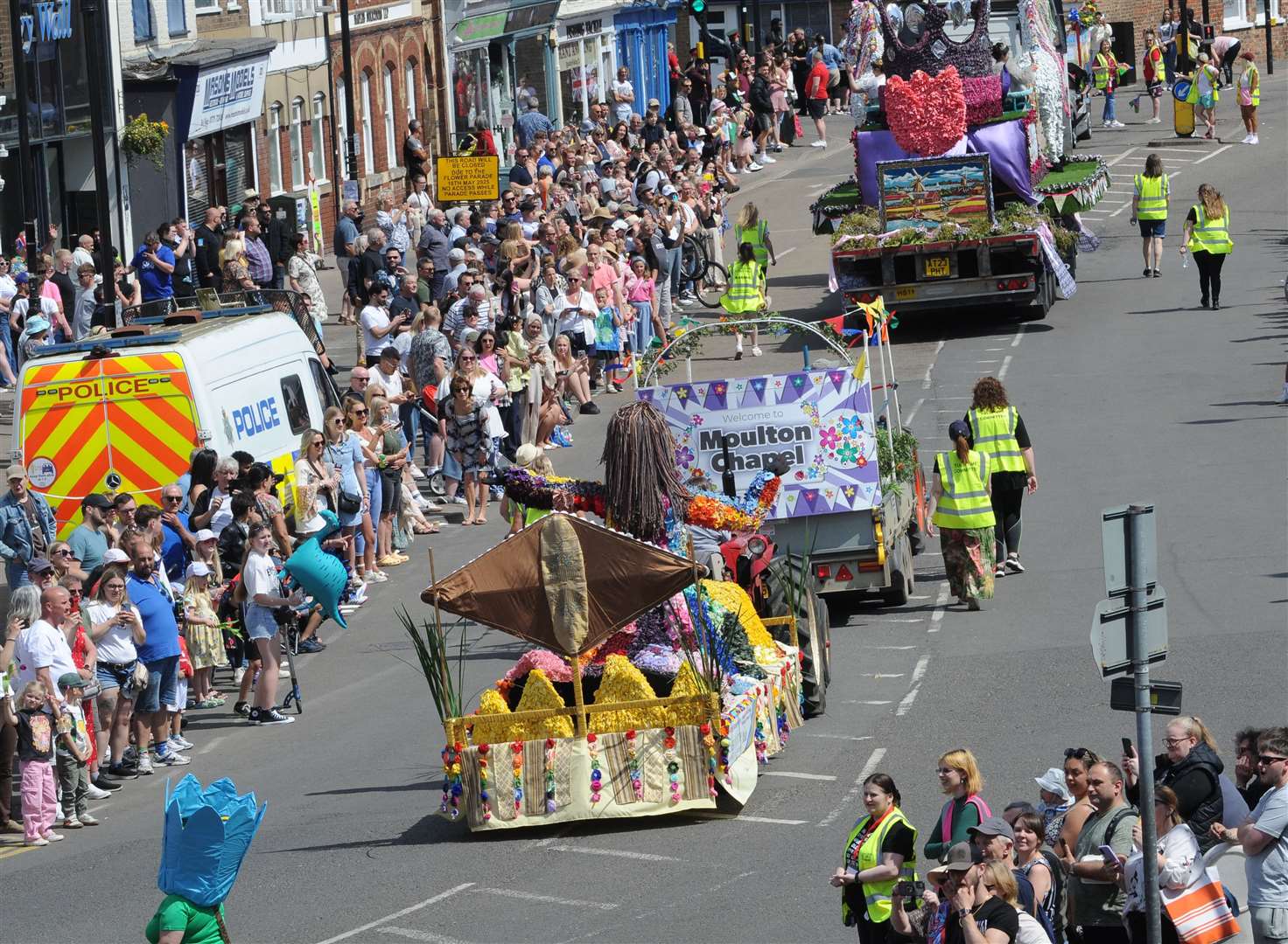 Crowds watch the procession along New Road PHOTO: CHRIS LOWNDES