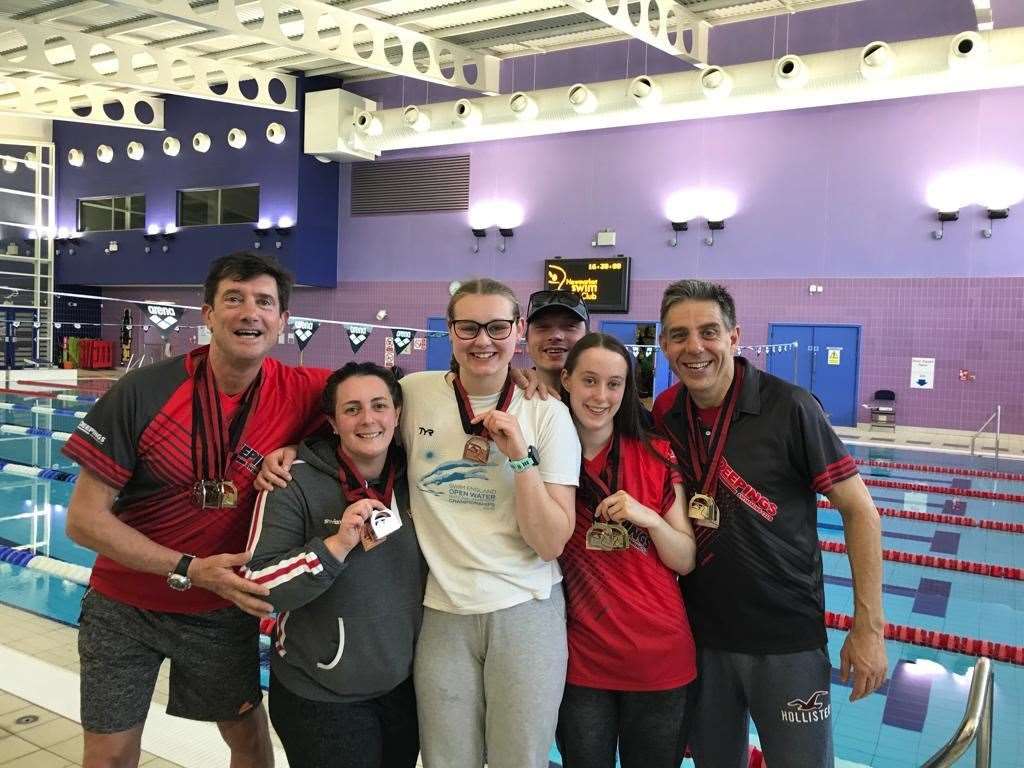 Tony Baskeyfield, Kerys Arundell, Alice Pinney, James Abbott, Helena Waters and Paul Smith-Shelton with their collection of 24 medals from Newmarket.