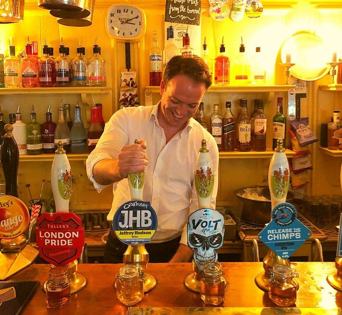 Gareth Davies MP behind the bar of the Tobie Norris in Stamford