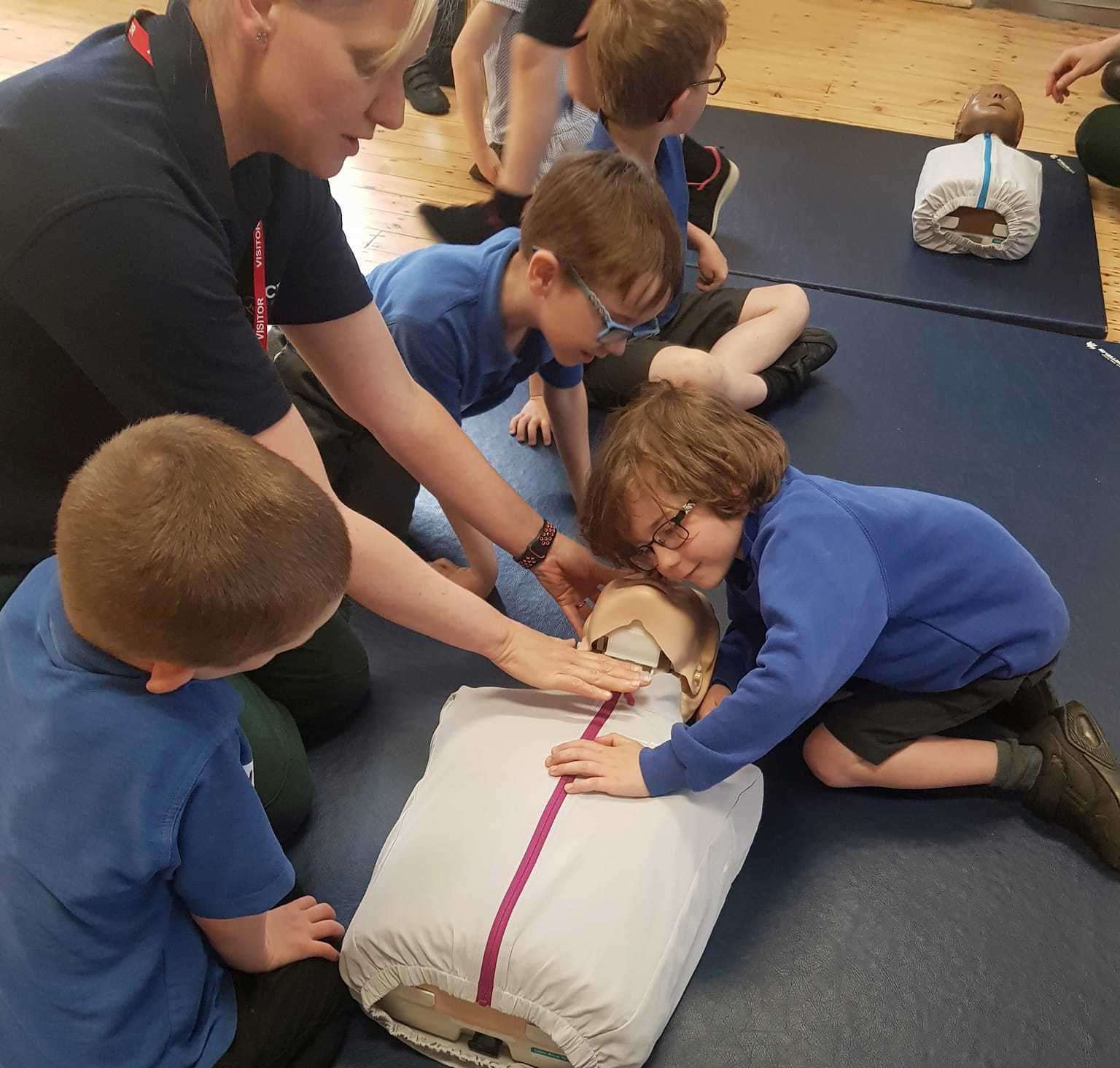 Paramedic Rachel Makin shows pupils how to do CPR