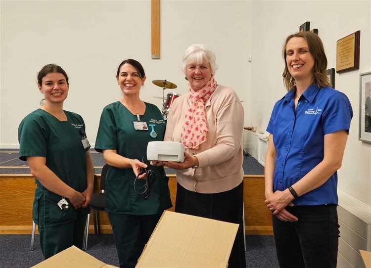 Chair Lesley Hart (third left) donating nebulisers to Grantham Hospital in July 2023.