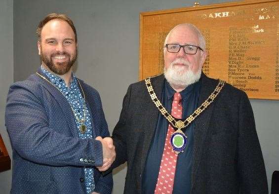 Coun Chris Nix congratulating new mayor Coun Paul Ainsley