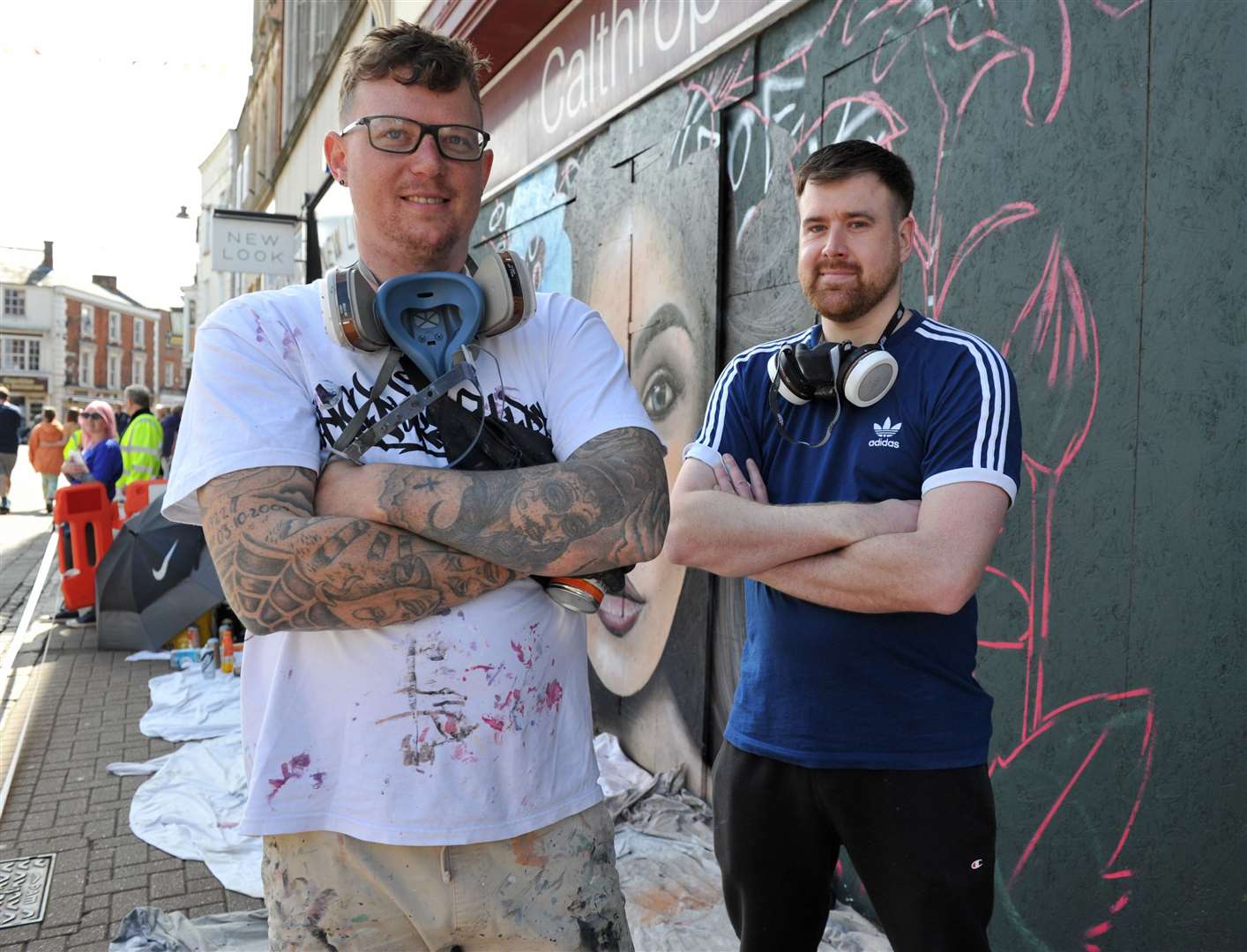 Karl Barfoot and Adam Sadd work on the mural