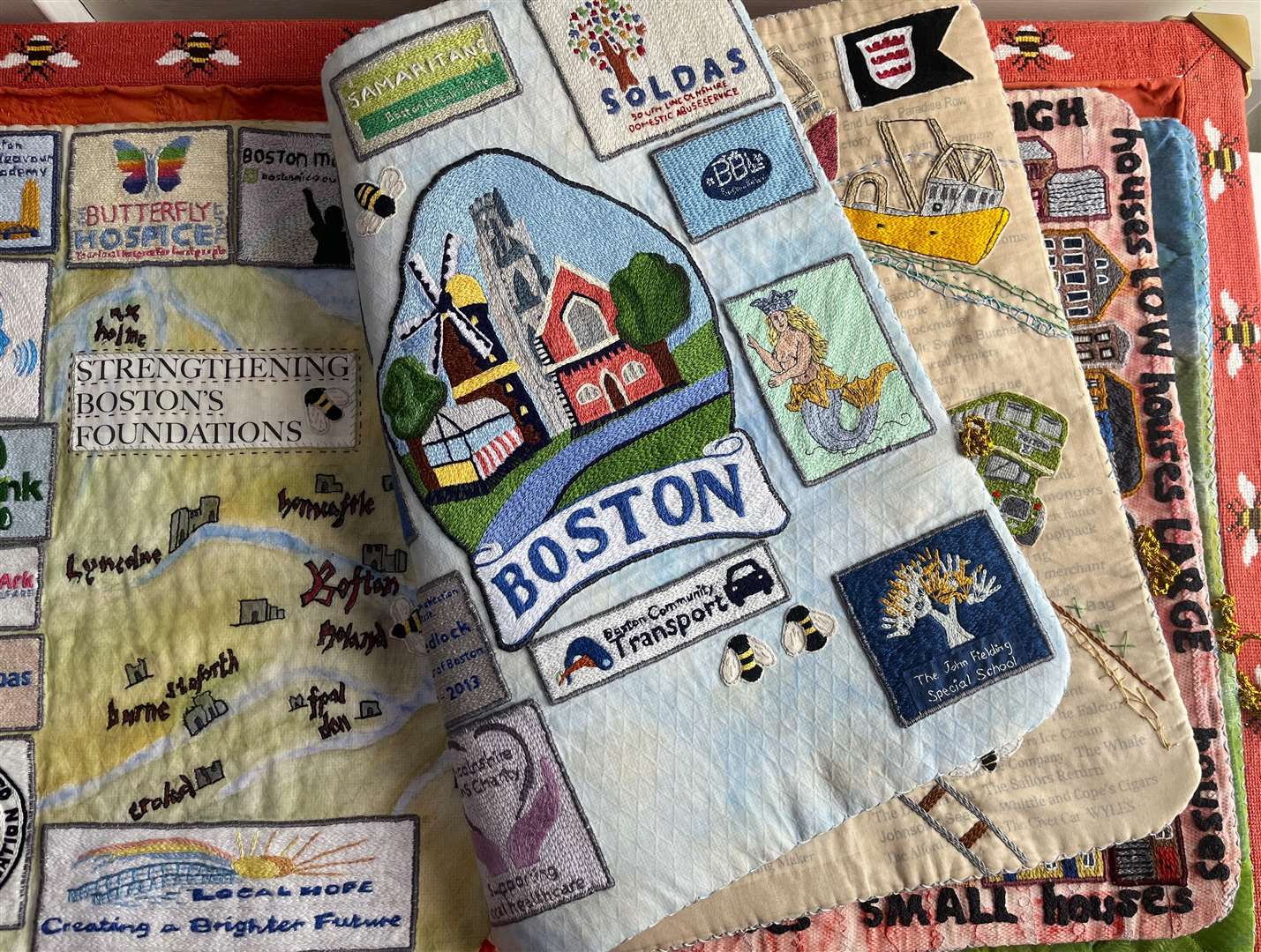 The 'build' book cover includes the Boston sign and area map