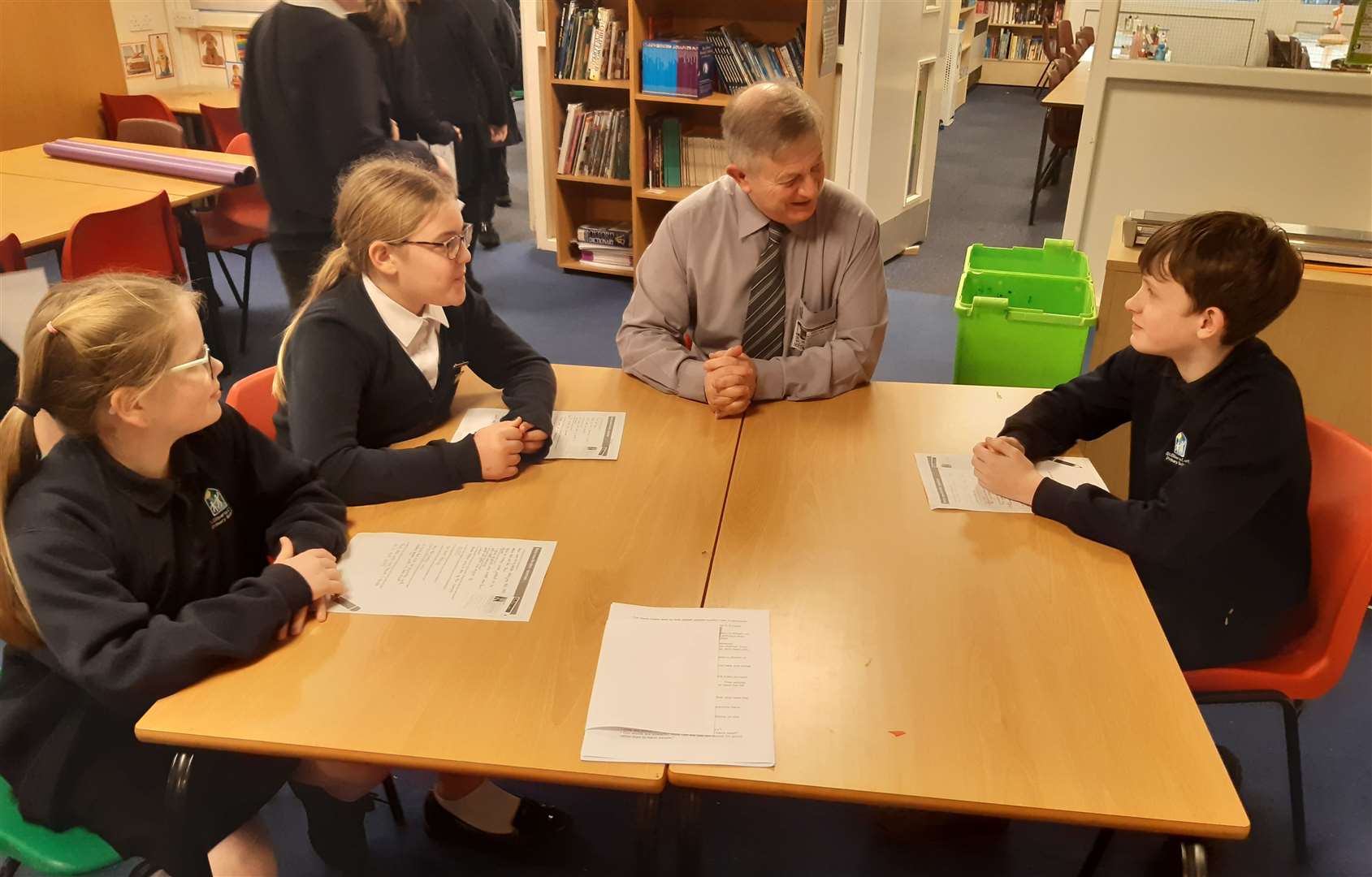 Rev Peter Stevenson talking to Grettel Petrie, Victoria Rigby and Daniel Strictley from St Gilberts School