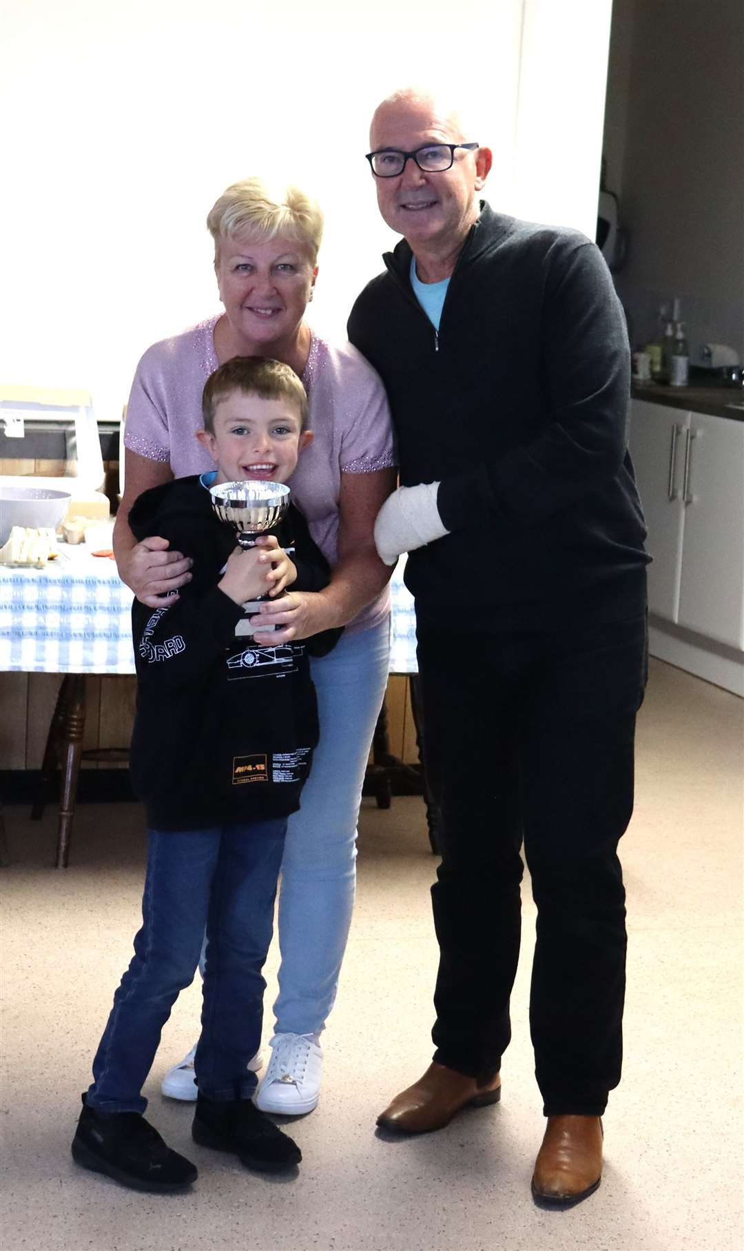 Andy Prior and Harry Jackson won the Carl Bilbie Pursuit Trophy. They are pictured with Commodore Sarah Prior.