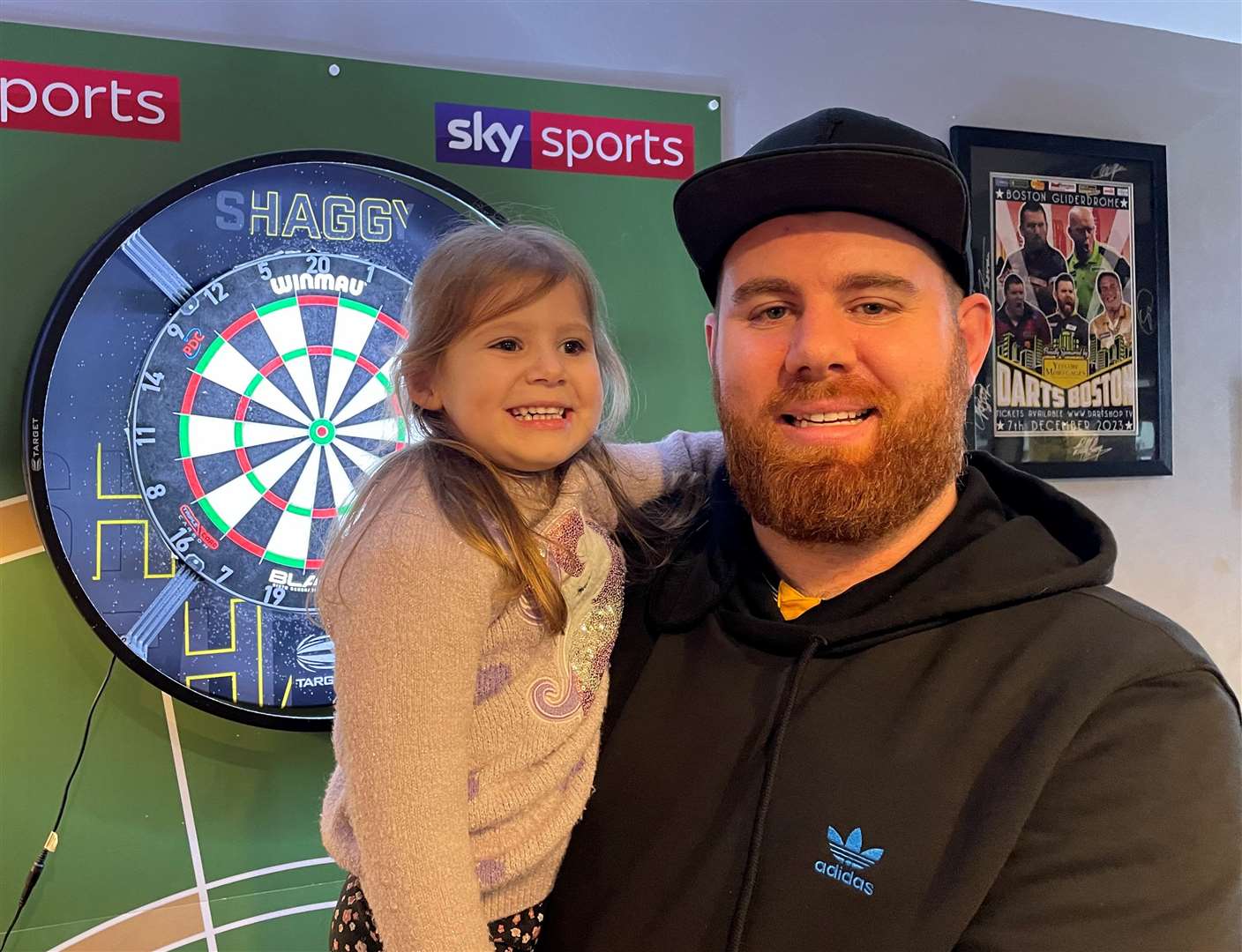 Oche ace Scott Williams with daughter Aurora