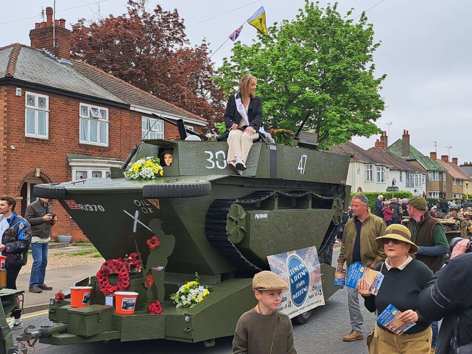 Miss Lincolnshire Paige Allen rides the Crowland Buffalo replica at the Spalding Flower Parade