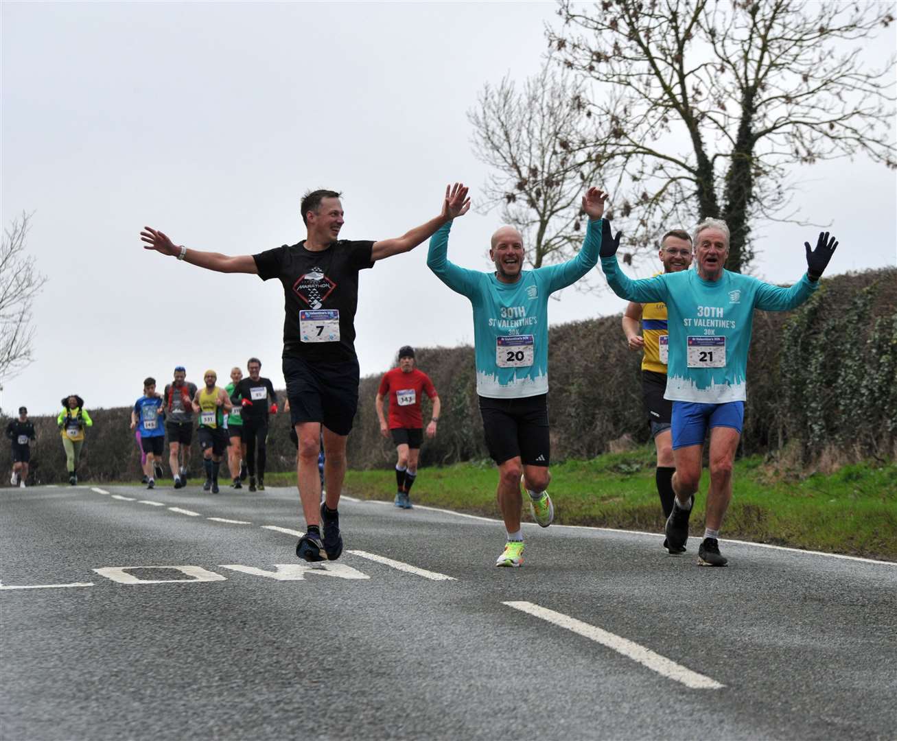 Stamford Striders James Abrahams, Chris Gold and Jim Grant give a wave. Photo: Chris Lowndes