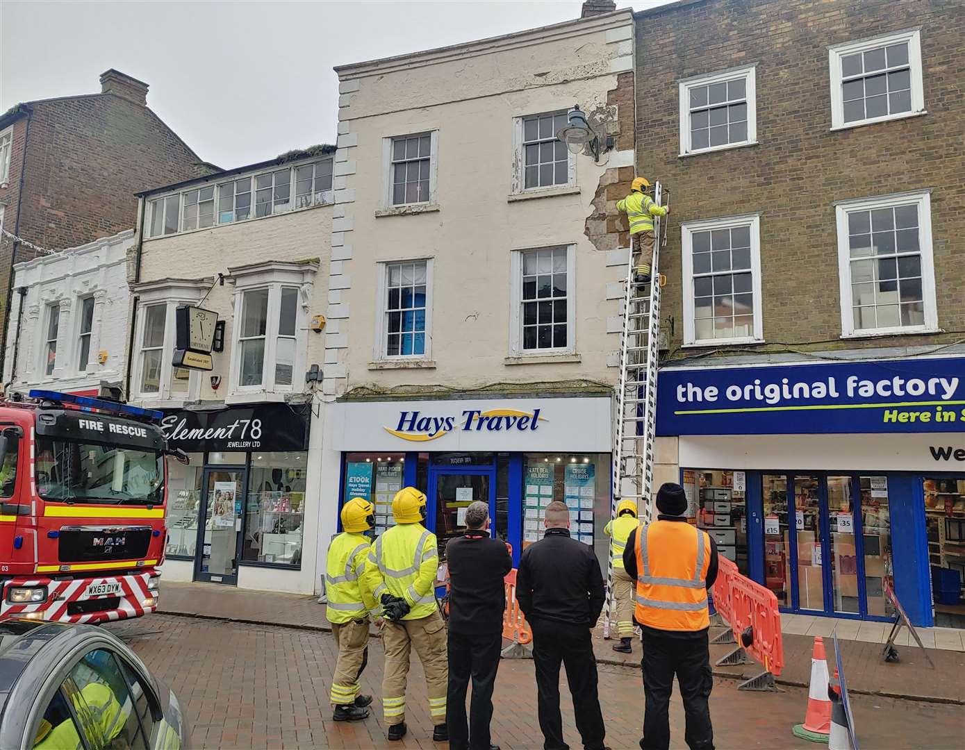 Emergency services to the Hays Travel site in Market Place, Spalding, after render fell PHOTO: JOHN BLAND