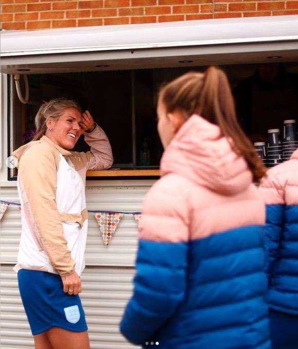 The Lionesses outside the Cafe Allez! mobile shop.