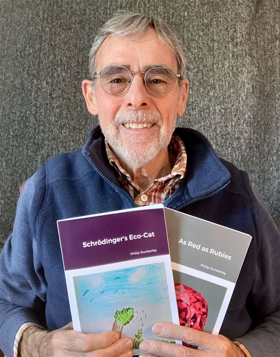 Bourne poet Philip Dunkerley with his latest two collections