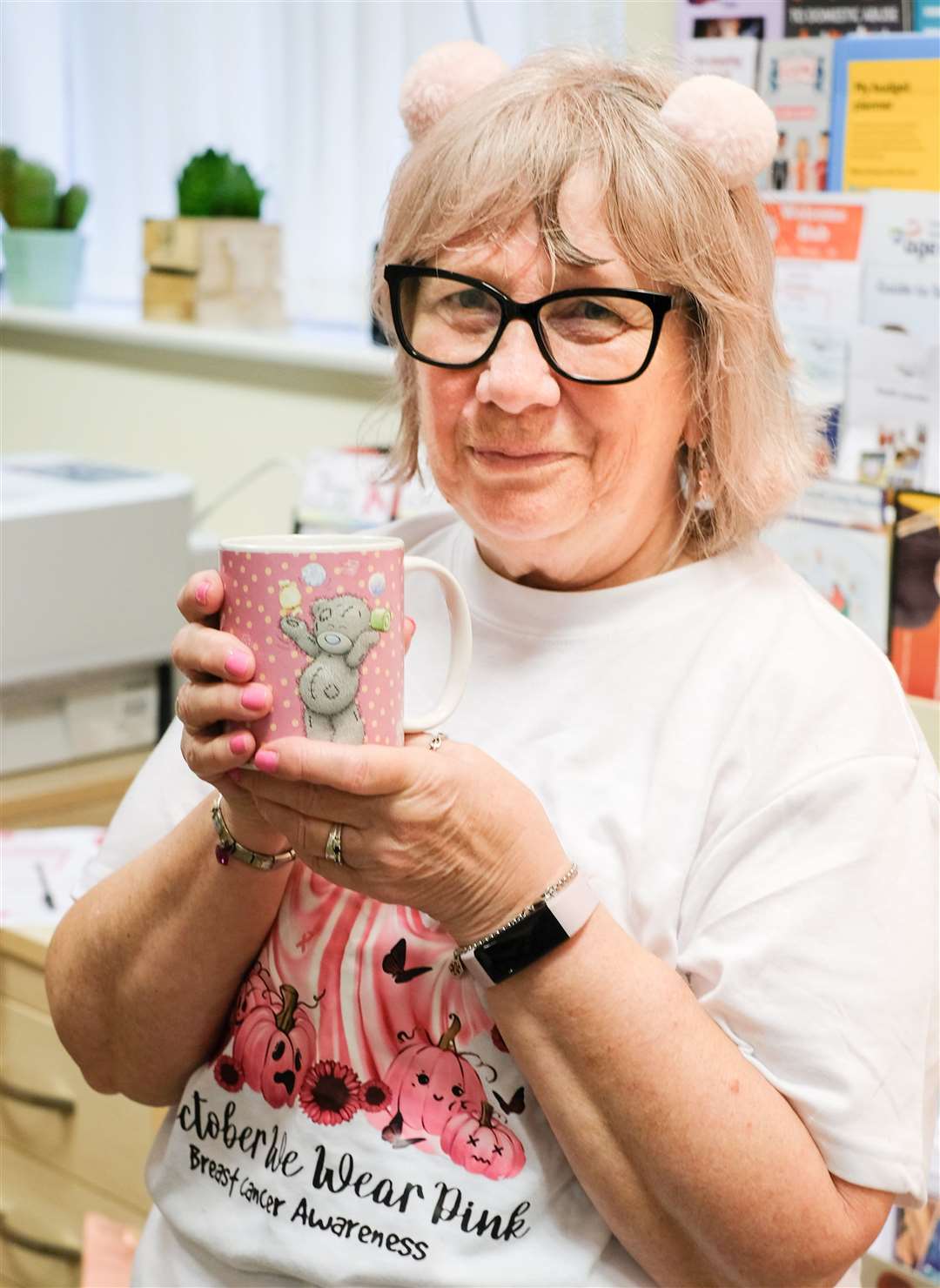 Boxes of Hope receptionist Carol Houlden who is wearing pink throughout October in aid of Breast Cancer Now. Copyright Ken Smith