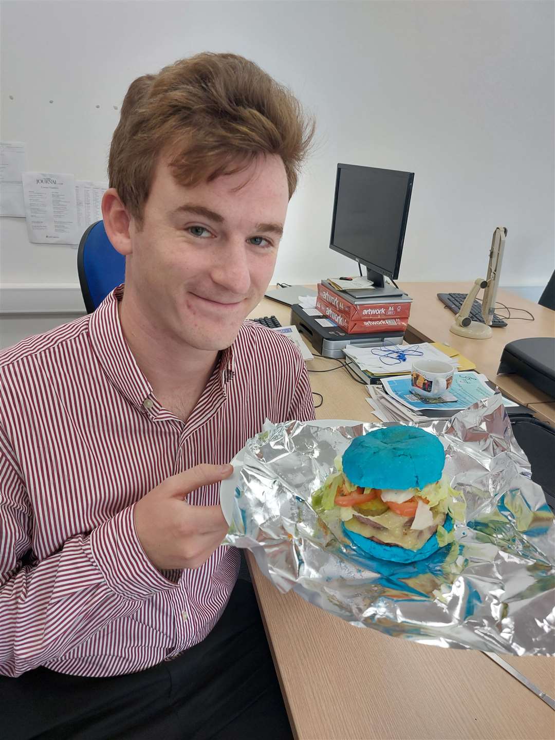Reporter Matt Taylor with the kangaroo burger. (60399815)