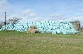 A stock photo showing bales of waste disguised as farming bales. Photo: Environment Agency