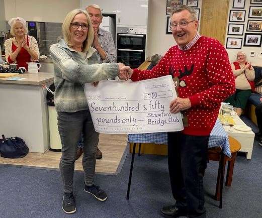 Sian Fytche, operations manager of Stamford Food Bank, received £750 from John Prior, chairman of Stamford Bridge Club, together with two large boxes of groceries