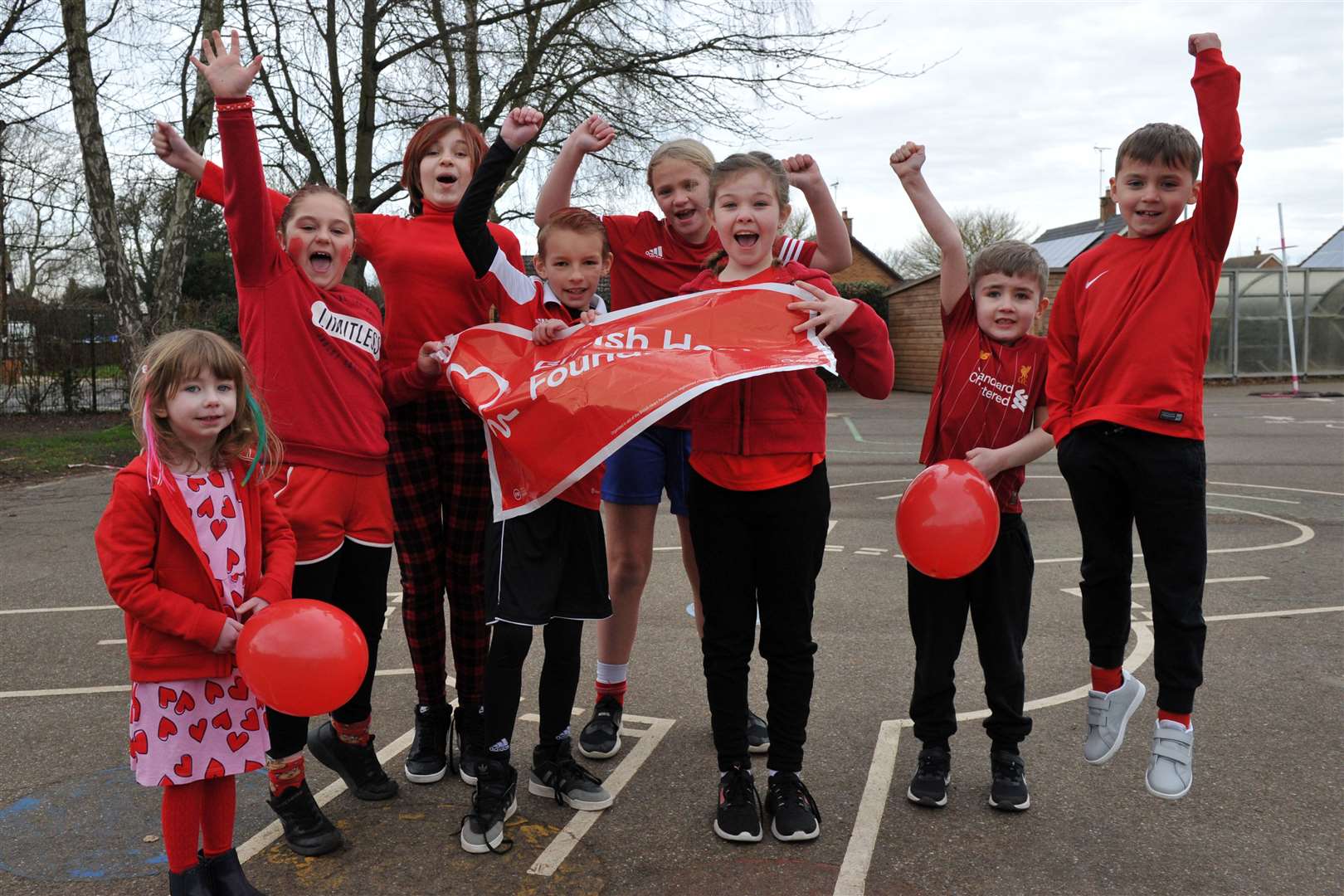 Youngsters wear it red at Lutton St Nicholas Primary School (62597029)