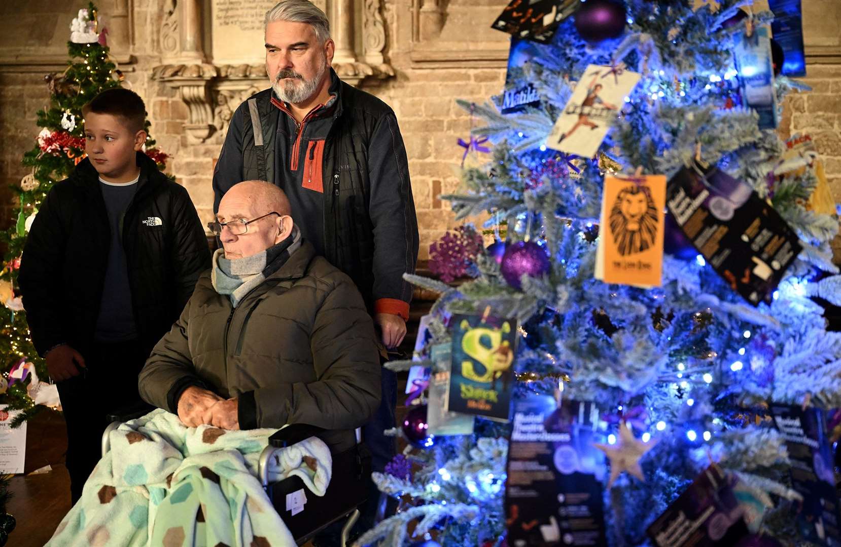 Visitors enjoying the St Wulfram's Christmas Tree Festival and skating rink.