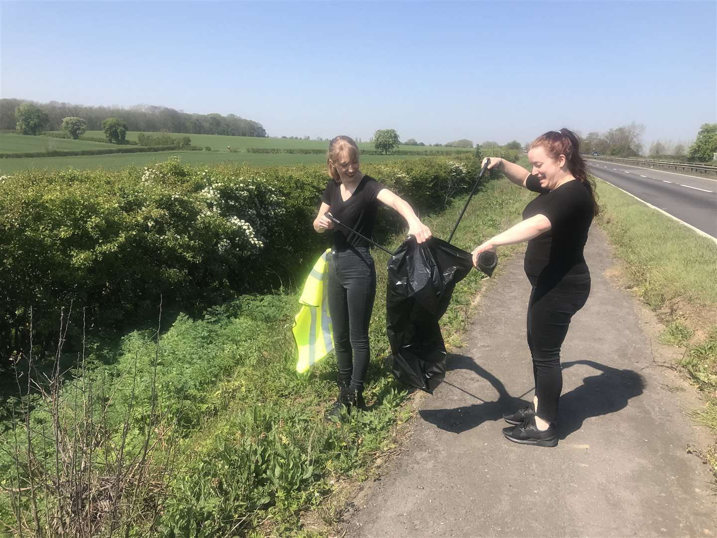 Stefanie Goatham and Nuria Collado-Garcia litter picking near Starbucks at Wittering (9389063)
