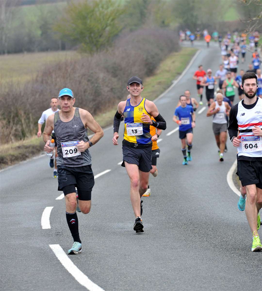 Neil Lakin in bib number 13 runs for Stamford Striders and finished in 2hr 21mins. Photo: Chris Lowndes