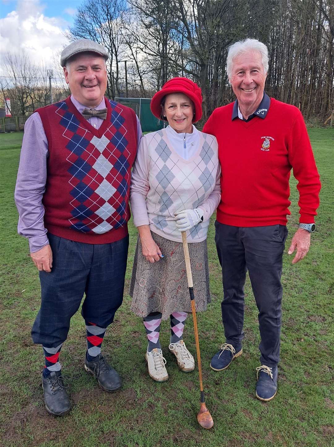 Peter Smith and Pauline Haggerty with Stoke Rochford Golf Club chairman Adrian Stannard.