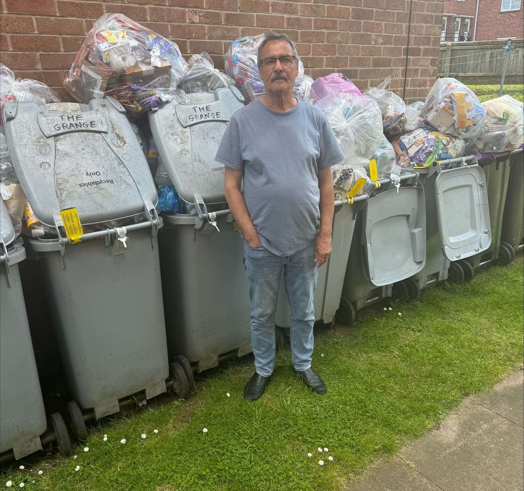 Resident Clive with the bins. Photo: Matt Bailey