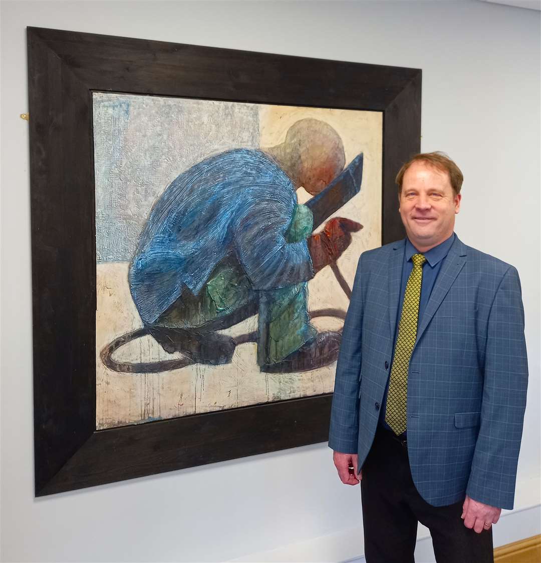 Councillor Ashley Baxter with artwork at South Kesteven House