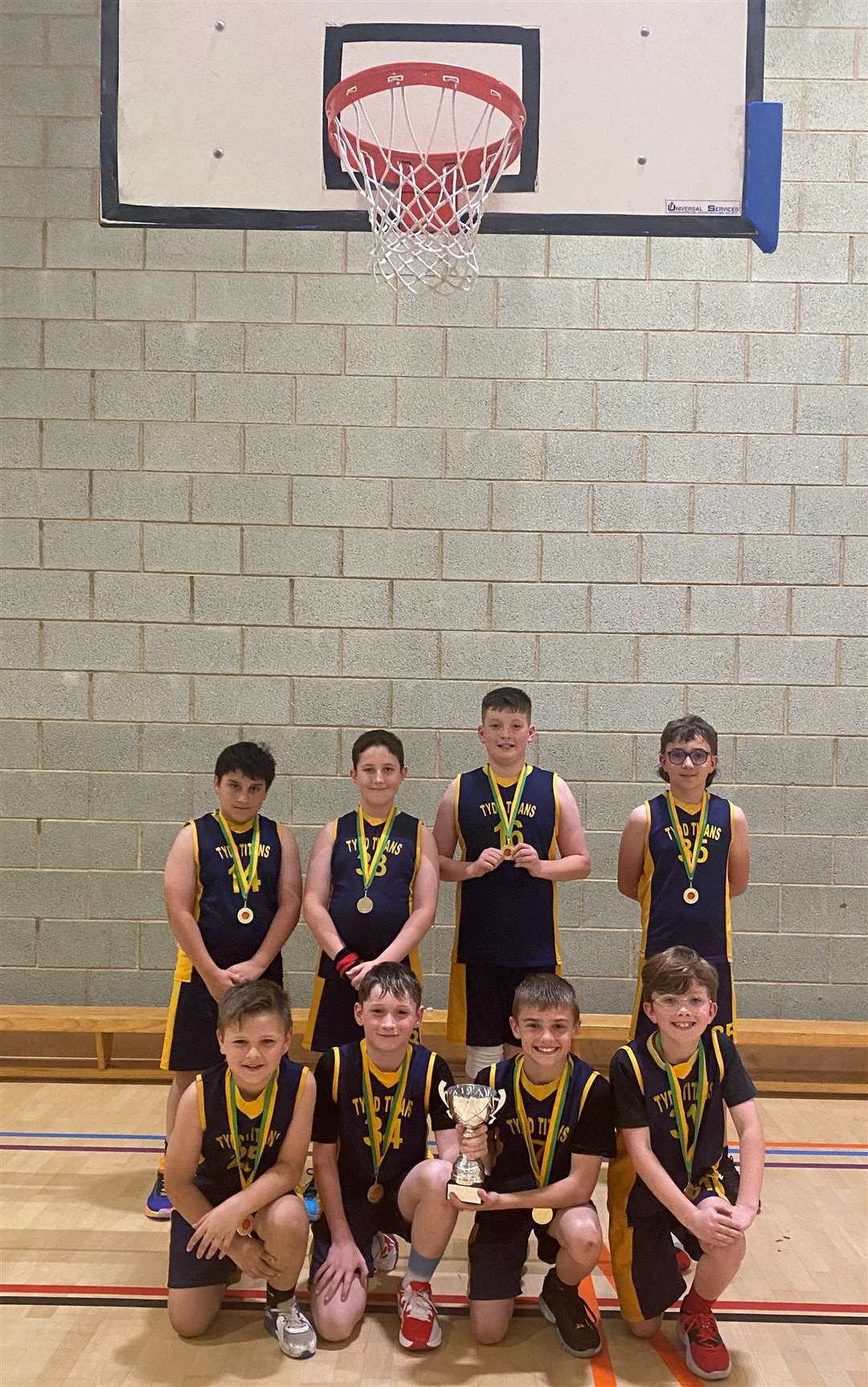 Titans with their medals and trophy they had won