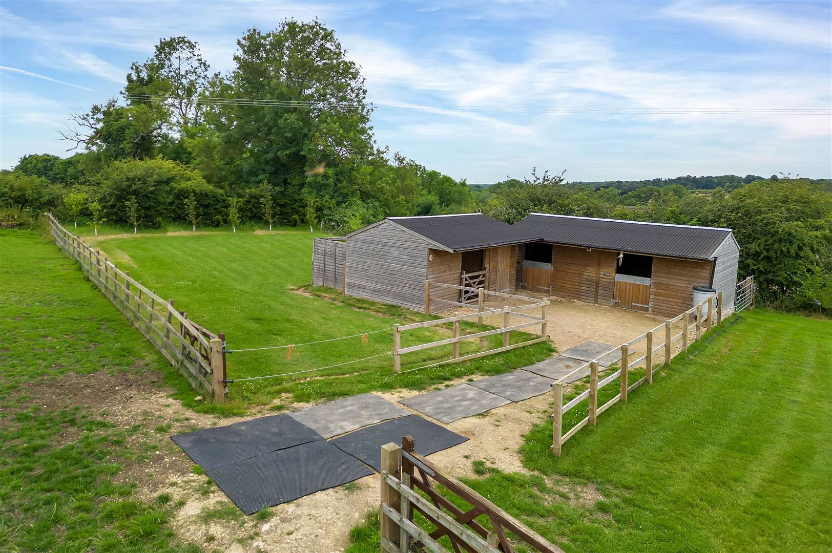 The property includes stables, a hay barn and tack room.