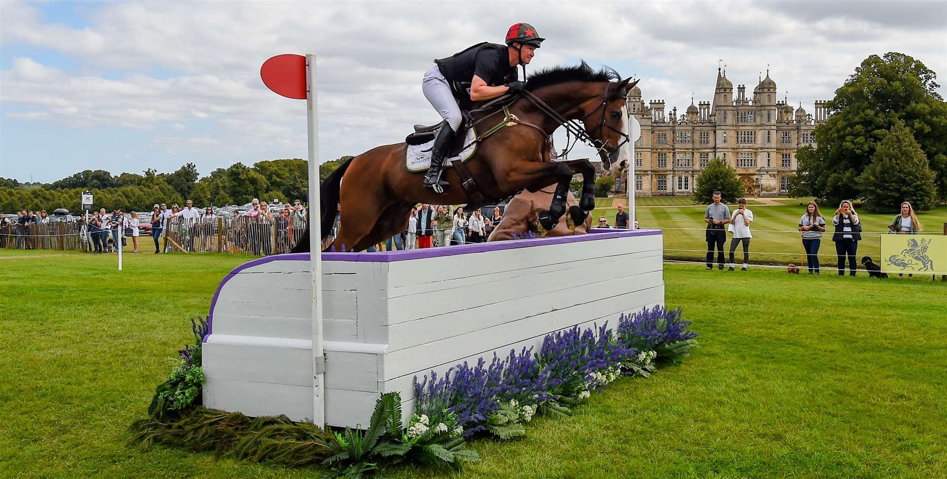 Matt Heath riding Askari during the cross country phase at the Defender Burghley Horse Trials.