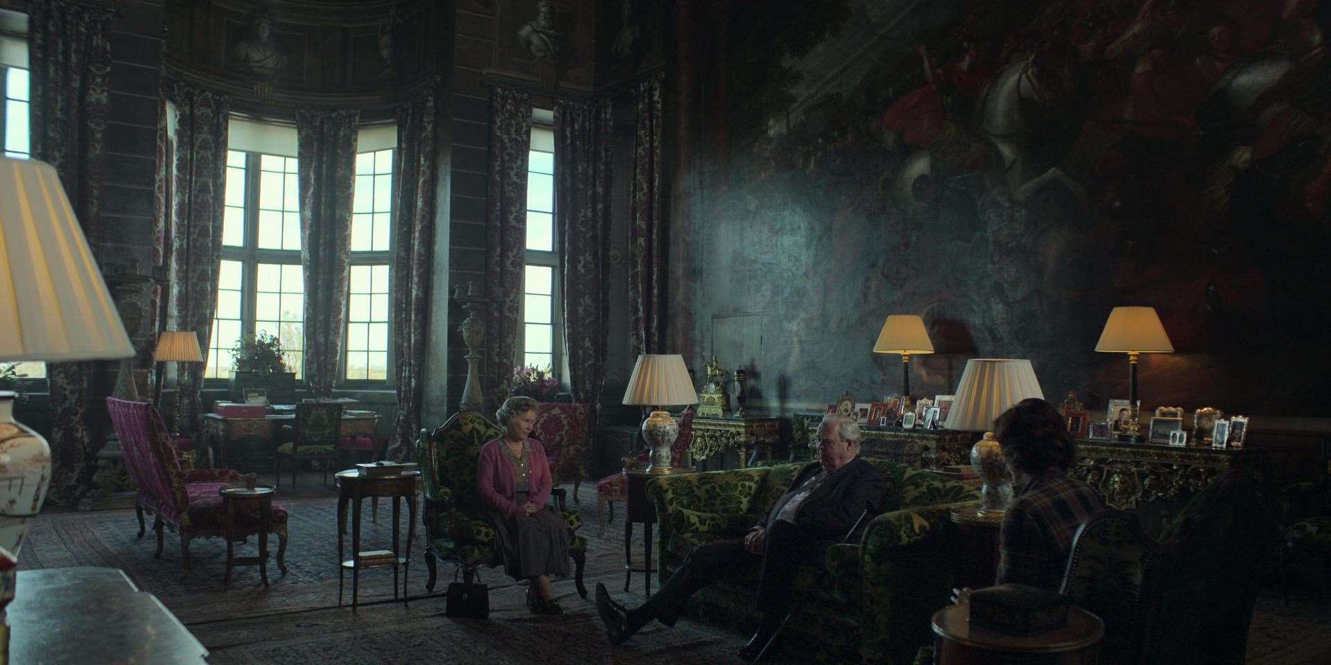 A scene from The Crown filmed in Burghley House featuring Queen Elizabeth, Duke Hussey, chairman of the BBC and his wife Lady Susan Hussey. Photo: Netflix