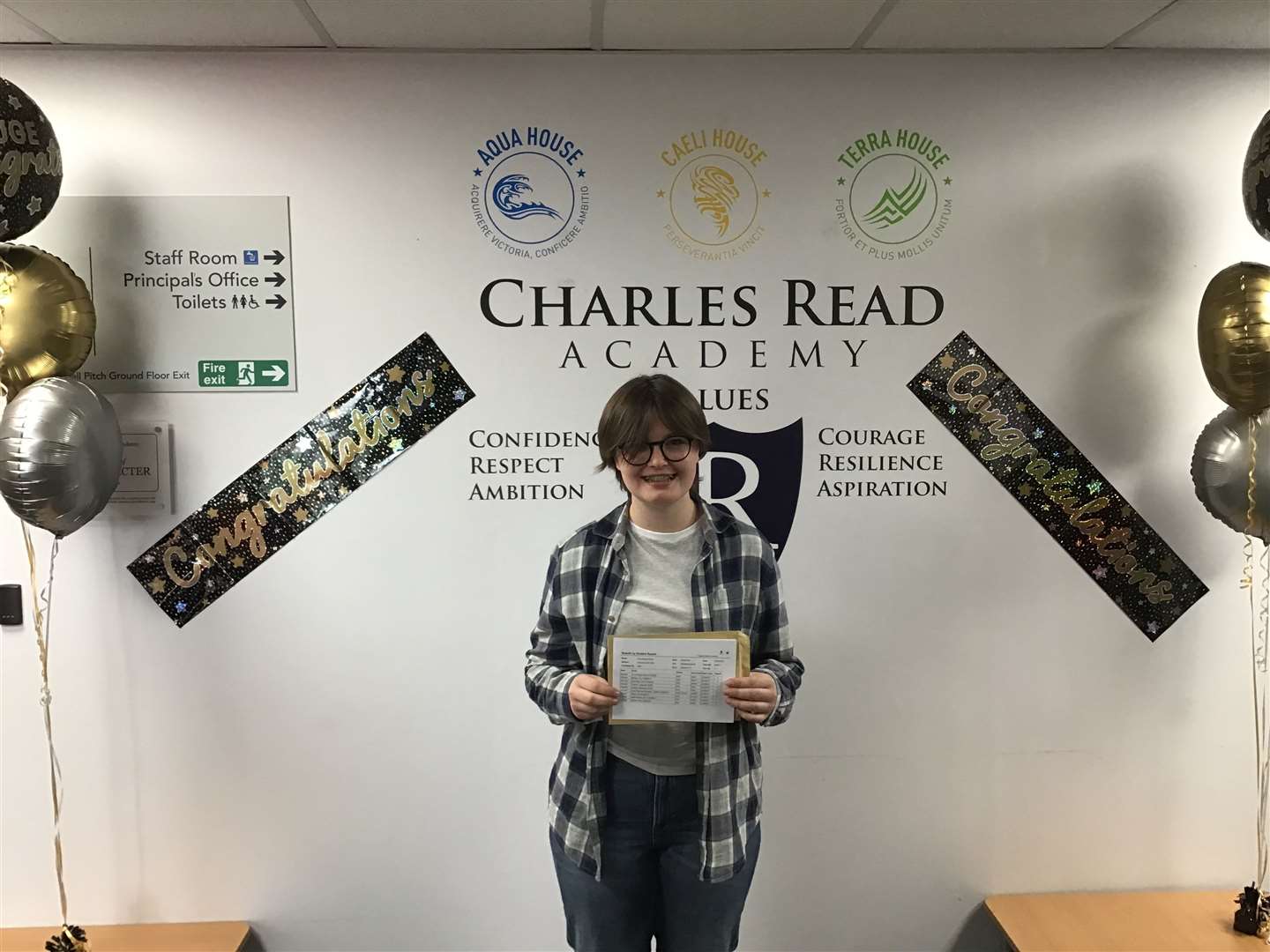 A Charles Read Academy student who is celebrating their GCSE success.
