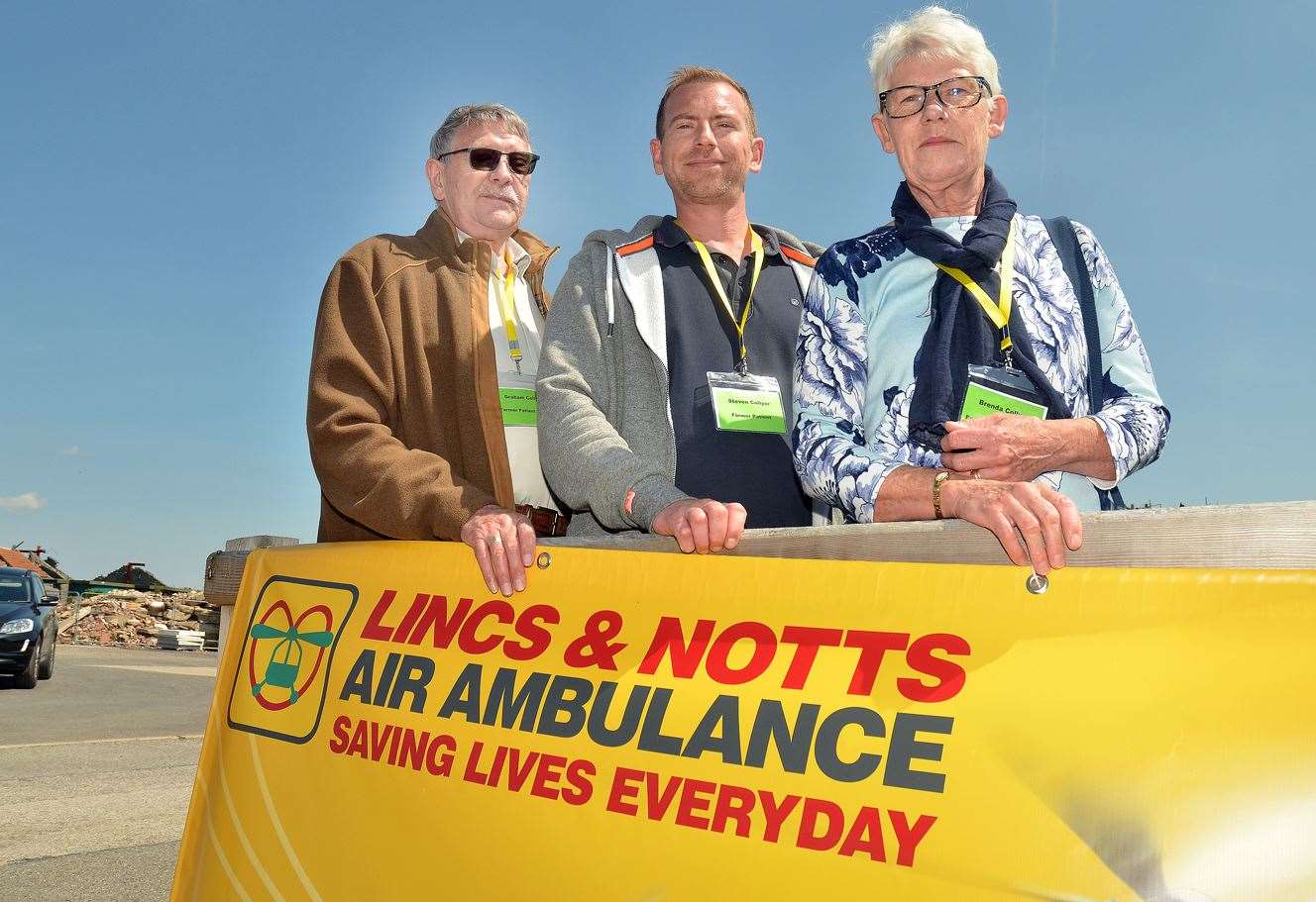 Former air ambulance patient Steven Collyer (centre), with his mum Brenda and dad Graham