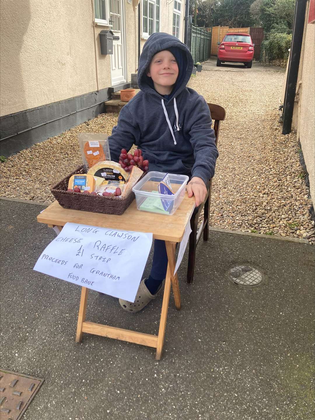David Martin, 10, sells cheese raffle tickets outside the Great Gonerby Post Office once a month to raise money for Grantham Foodbank. (63483665)