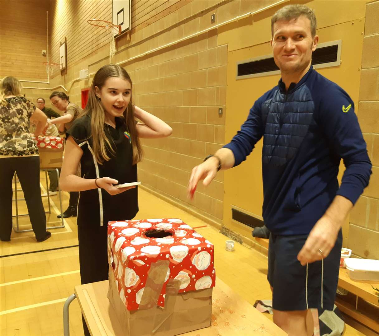 Maisie Staniland timekeeps as PE teacher Chris Emmerson starts the feely box challenge