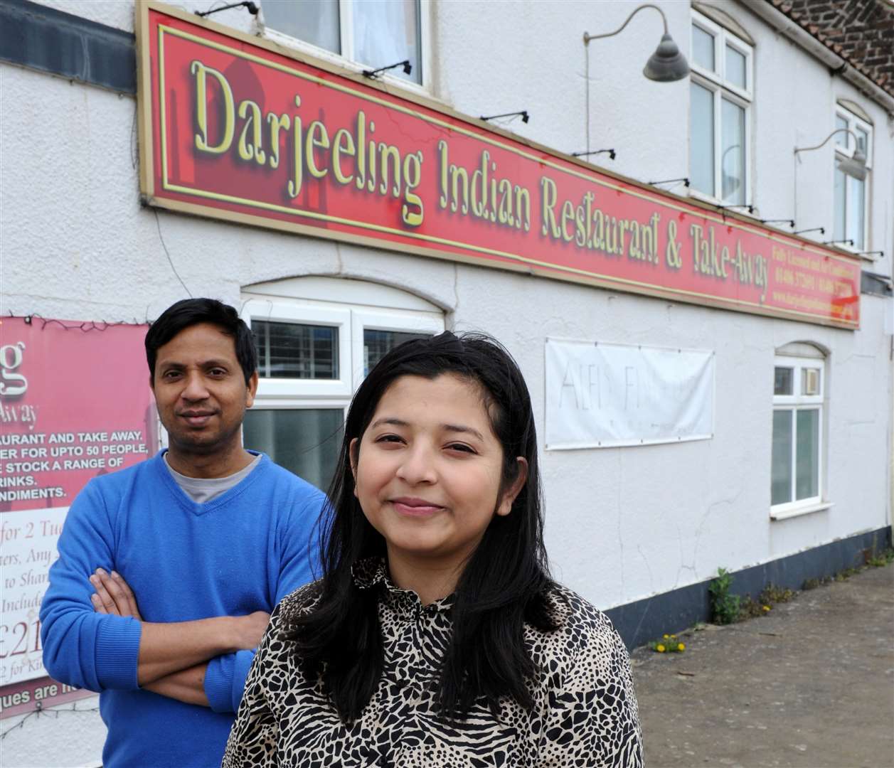 Mohammed Khan and Isratjahan Ankhi, outside the Darjeeling Indian Restaurant and Takeaway in Whaplode