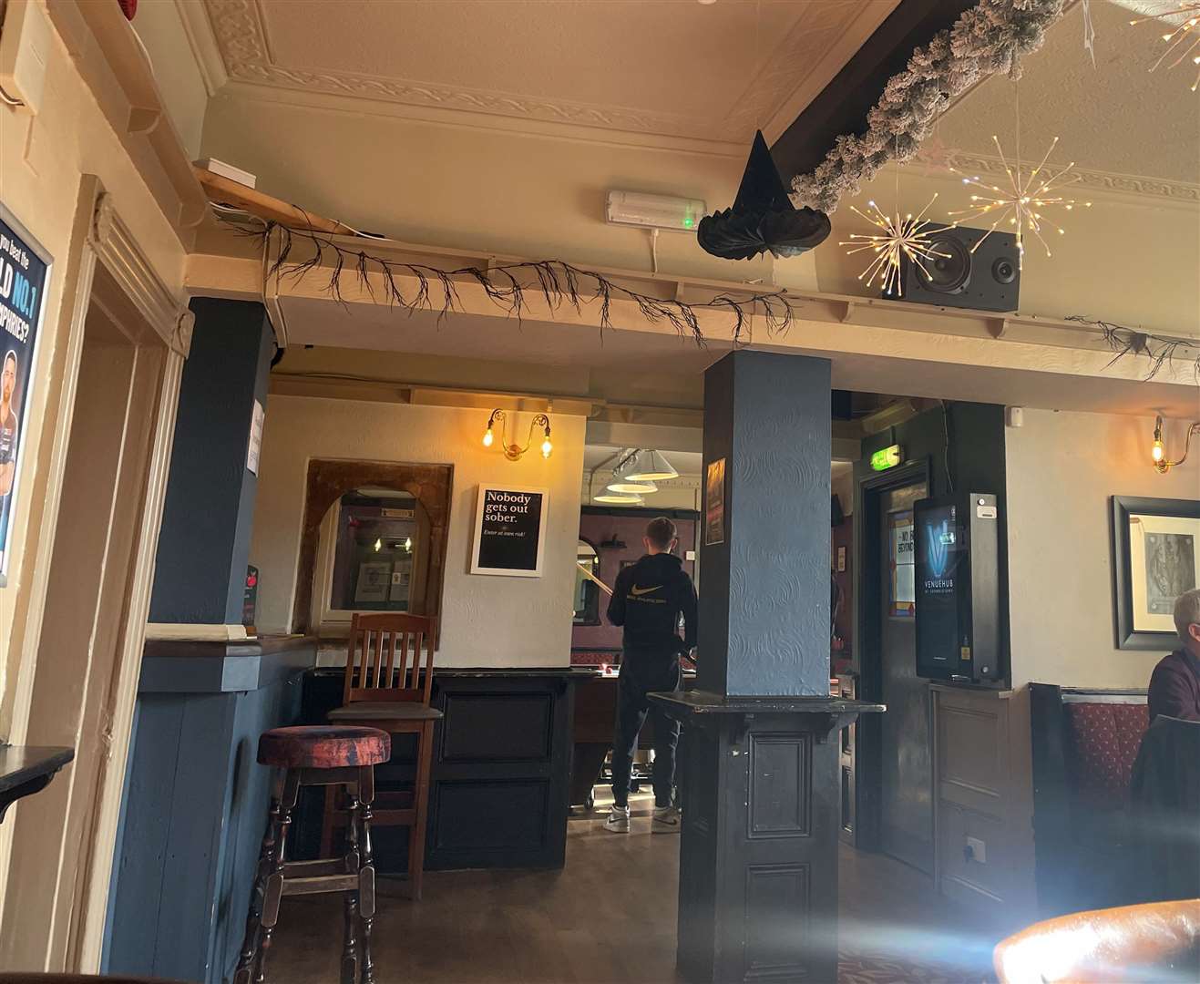 A witches hat hangs from the ceiling