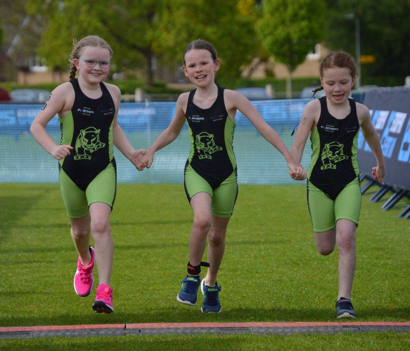 Ketton Panthers crossing the finish line at Uppingham in May.